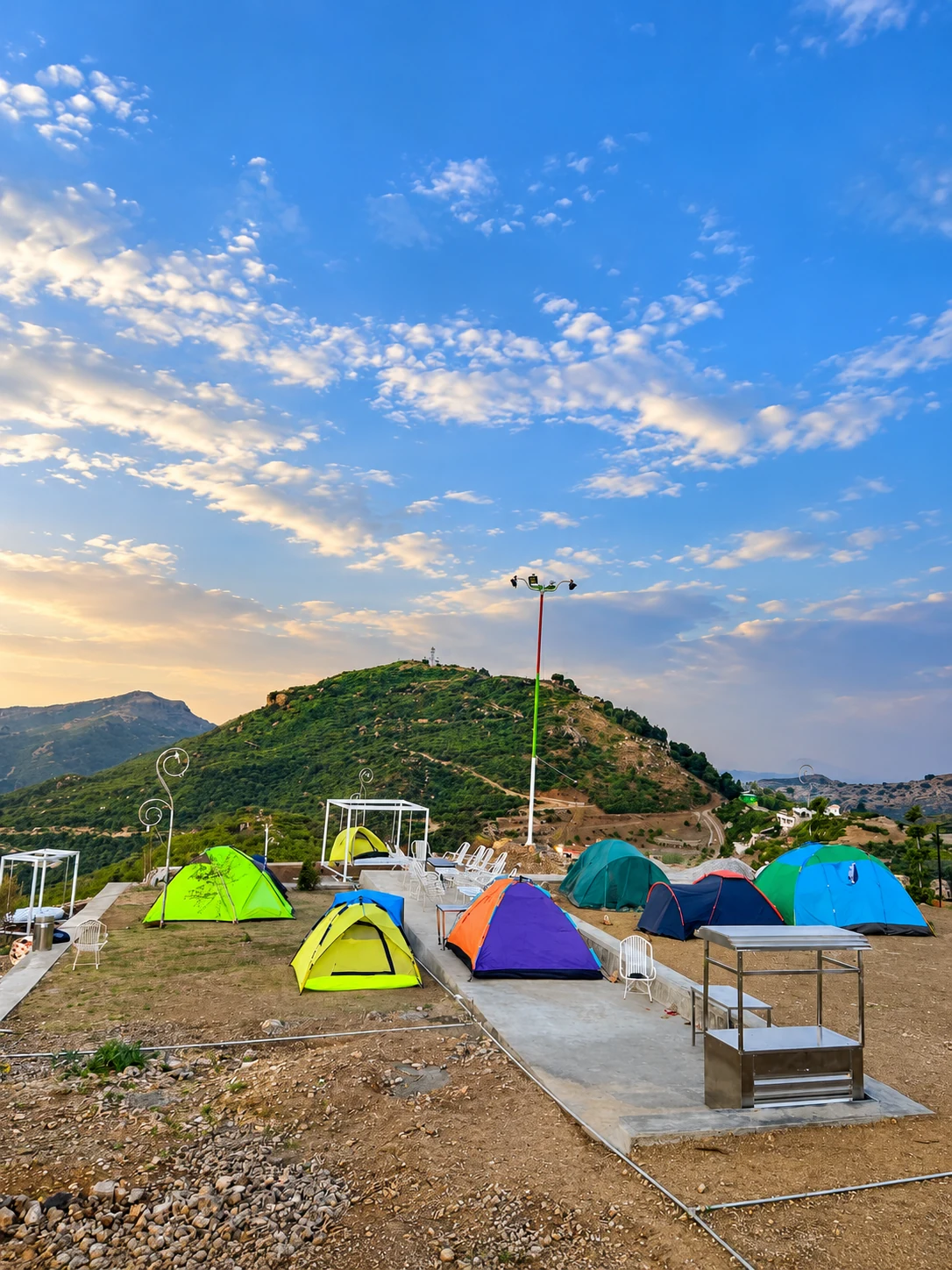 Colourful tents at the Pristine hillside camping site